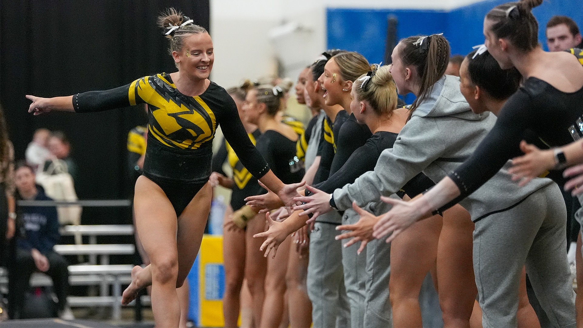 2026 Jay Ratkowski Action Shot, celebrating after completing her floor routine against Hamline