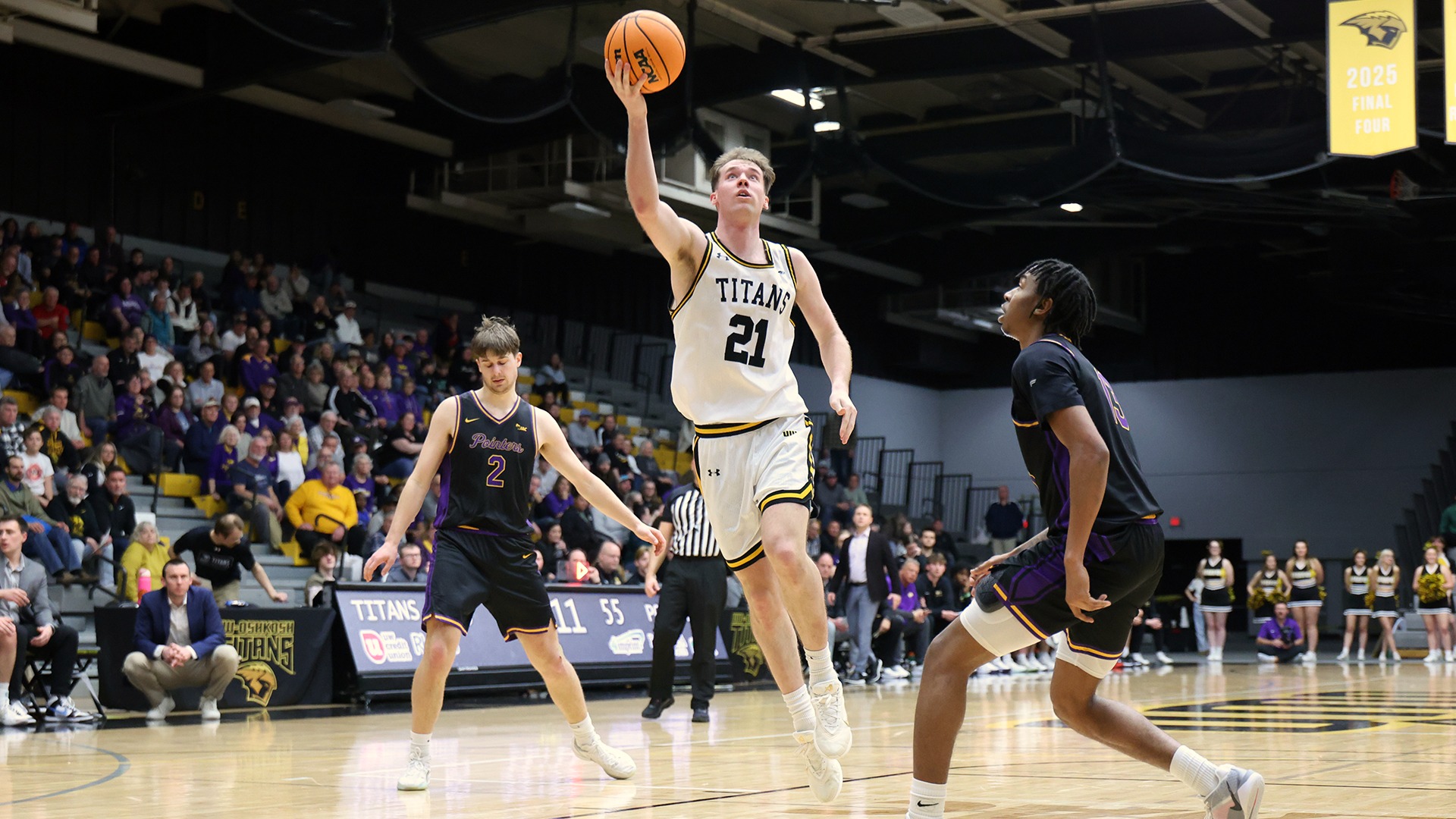 2026 Carter Thomas Action Shot, going up for a layup against Stevens Point