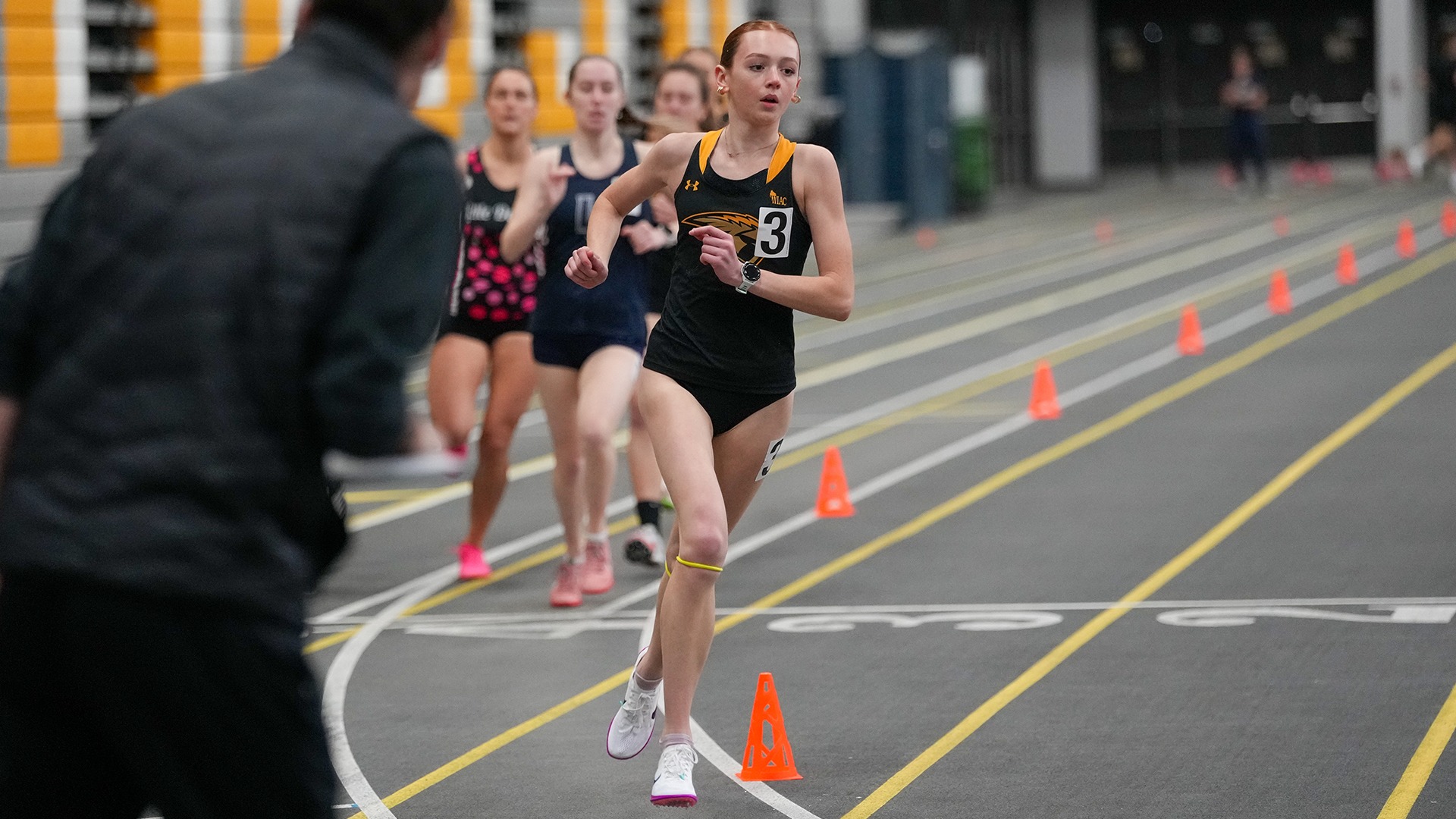 2026 Lehna Mitchell Action Shot, running in the Oshkosh Alumni Meet