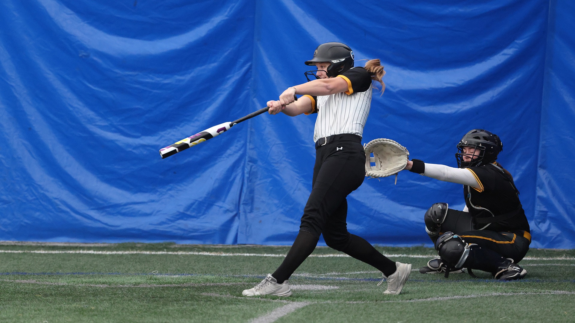 2026 Sarah Hammerton Action Shot, hitting against St. Norbert