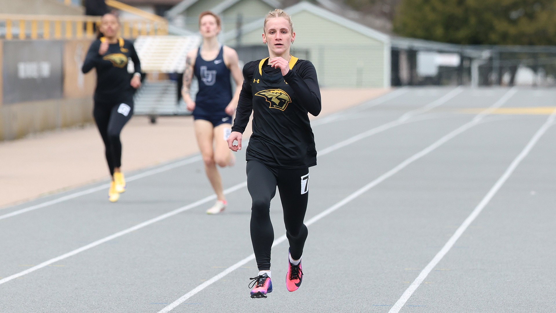 2026 Addie Baker Action Shot, running the 400-meter dash during the Oshkosh Invitational