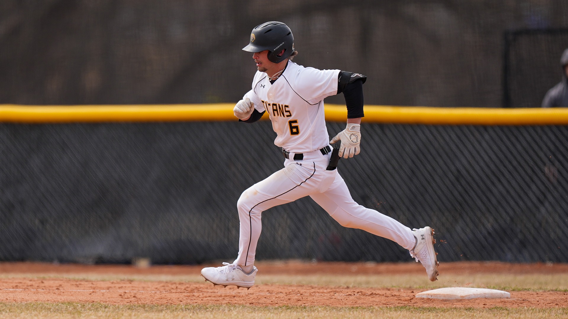 2026 Logan Schill Action Shot, running to second base against Eau Claire- Game 1