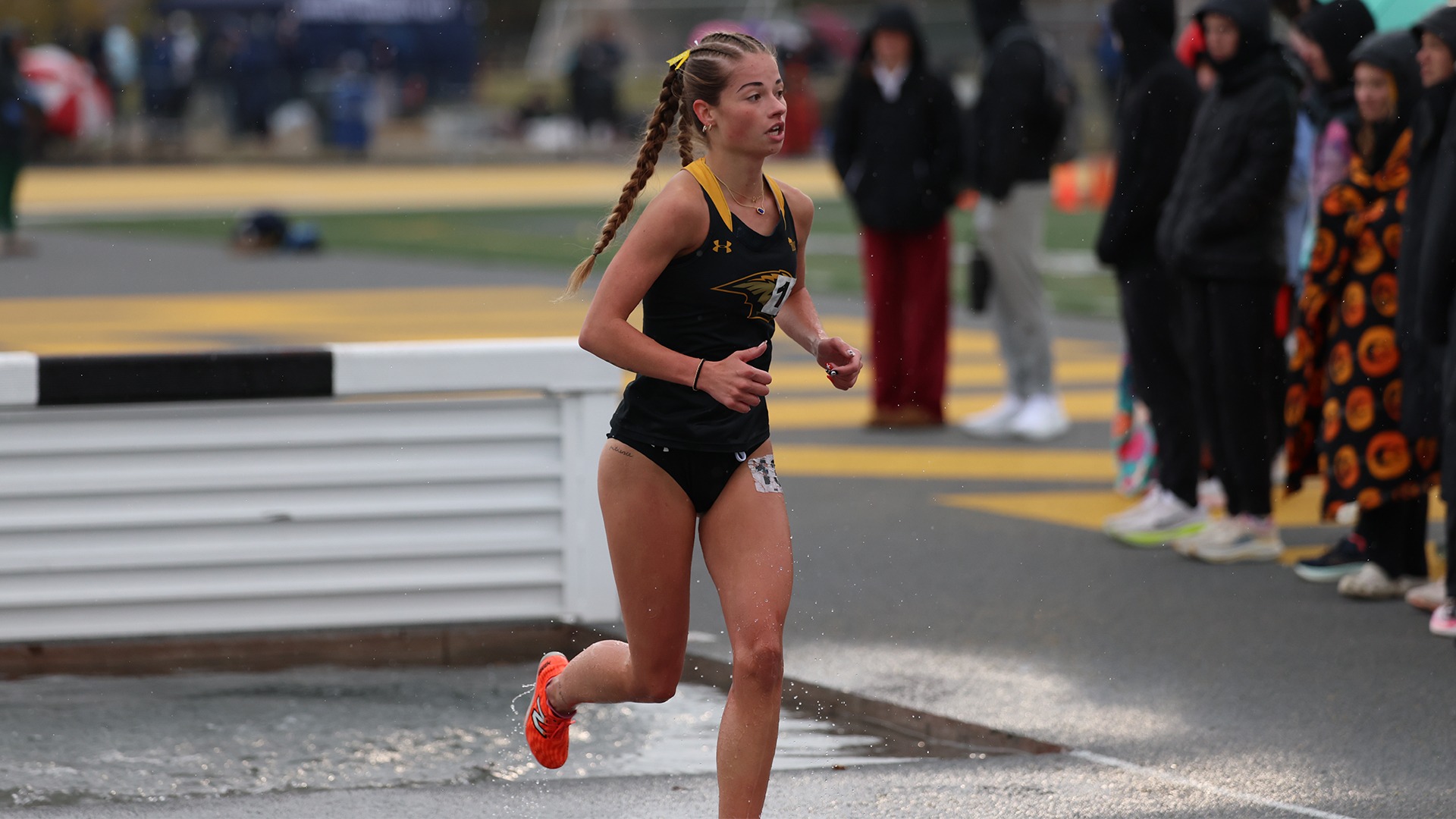 2026 Emma Boegh Action Shot, competing in the steeplechase at the Oshkosh Titan Invitational