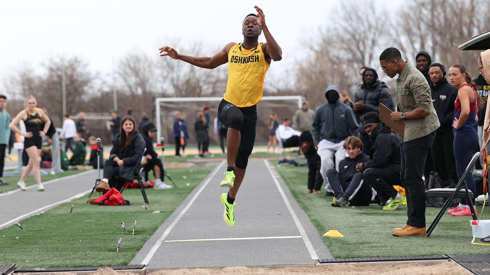 2026 Caleb Wright Action Shot, competing in the long jump in the Oshkosh Titan Invitational