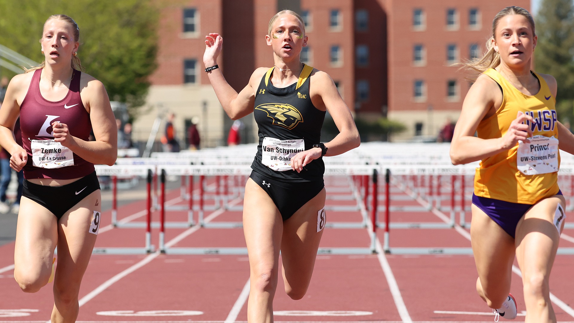 2026 Maya Van Schyndel Action Shot, running in the 100-meter hurdles at the WIAC Outdoor Championship