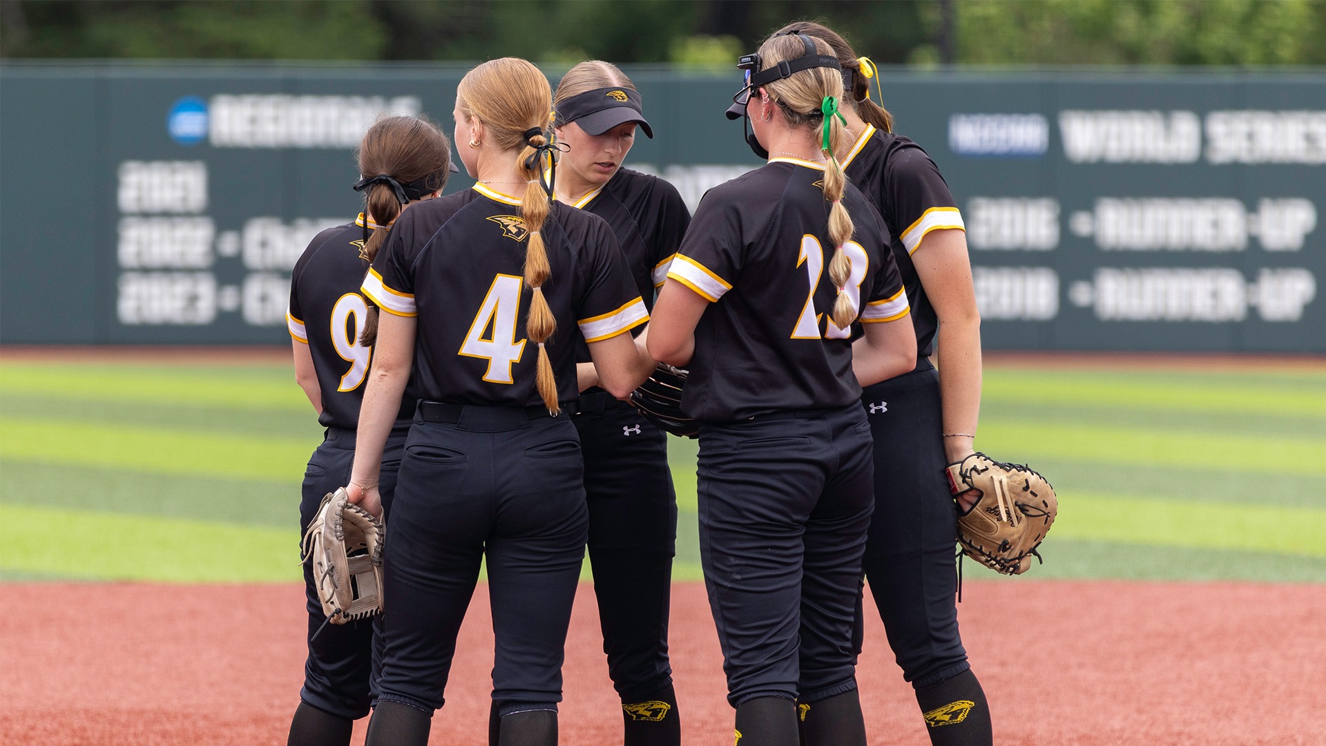 2026 Softball Group Action Shot, infielders meeting in the circle against Belhaven- NCAA Game 2