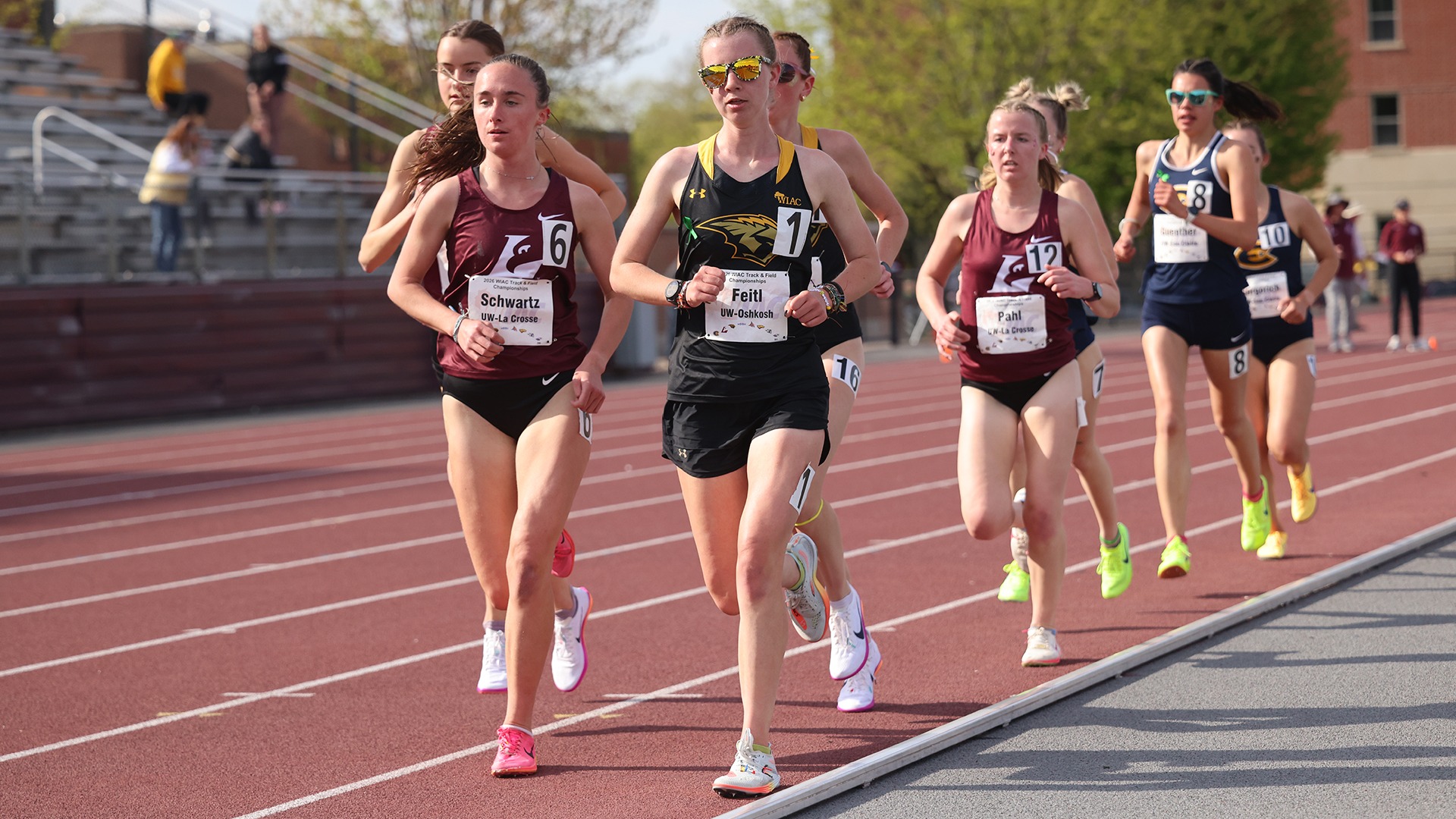 2026 Gwen Feitl Action Shot, running at the WIAC Outdoor Championship