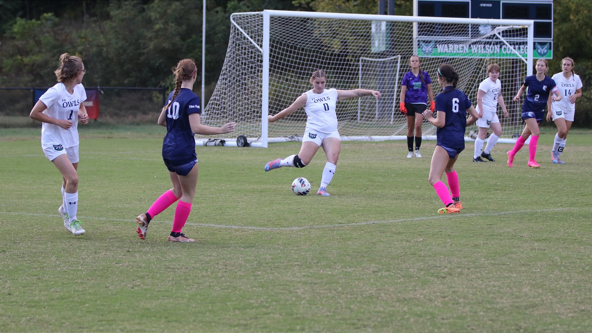 Sabine Costello-Sanders kicks the ball past the defense during the soccer game