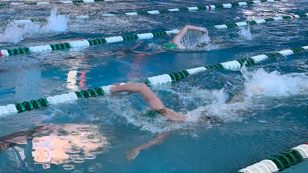 Warren Wilson's Swimming Team prepares for meet by practicing in the pool before the match