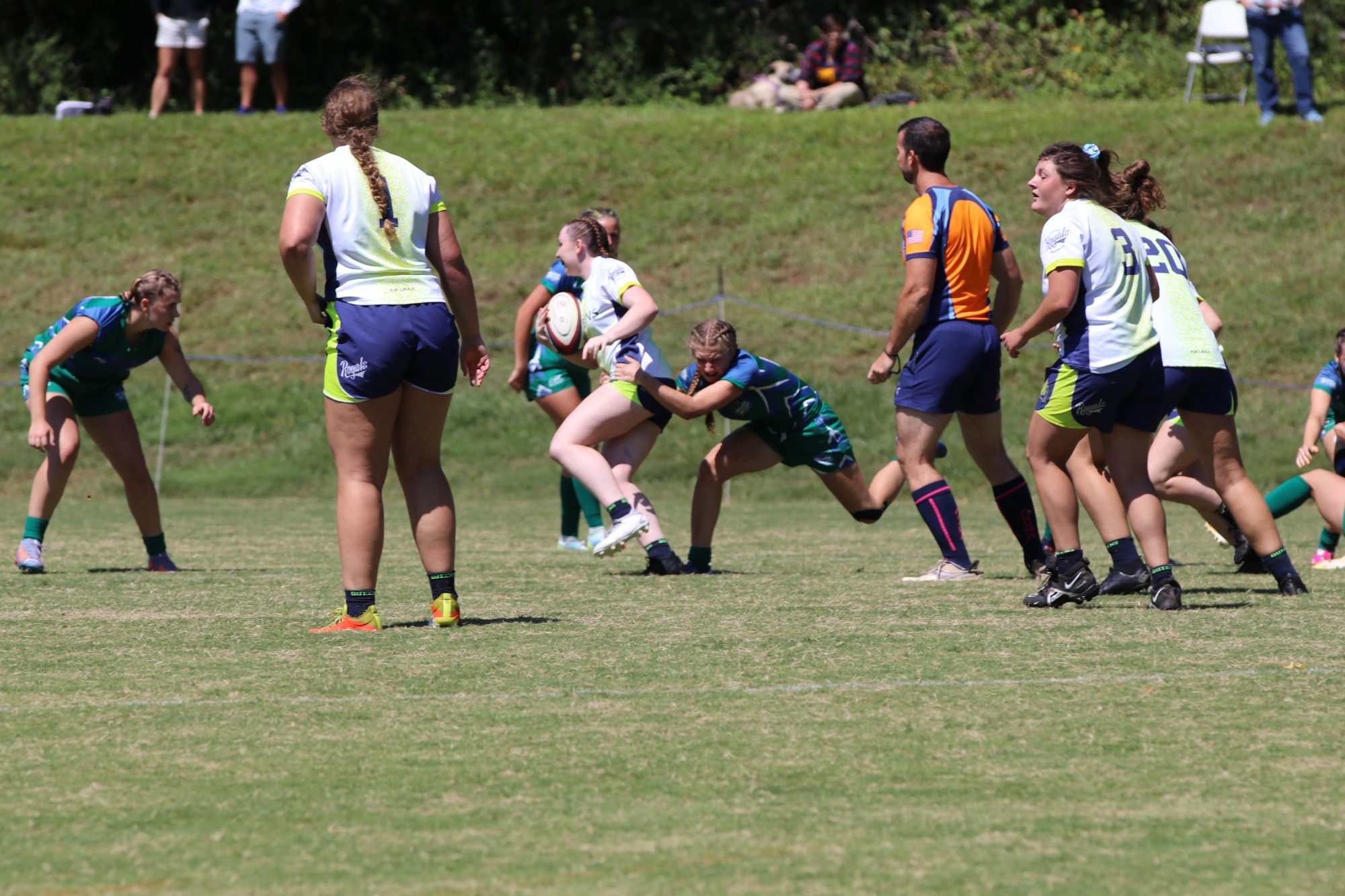 Women's Rugby player, Ella Knecht tackles her opponent on the rugby pitch.