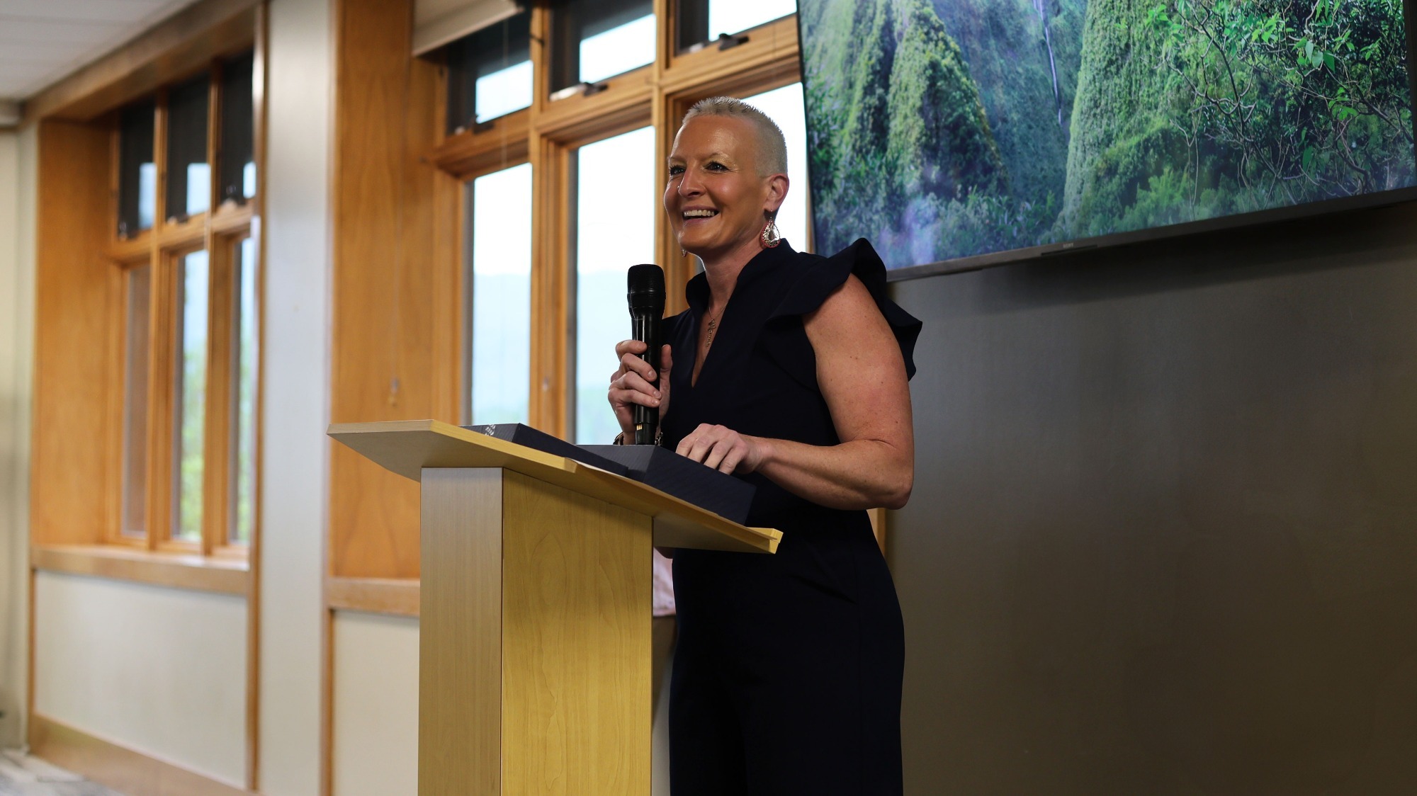 Athletic Director Robin Martin Davis addresses the crowd on the microphone as the banquet begins.