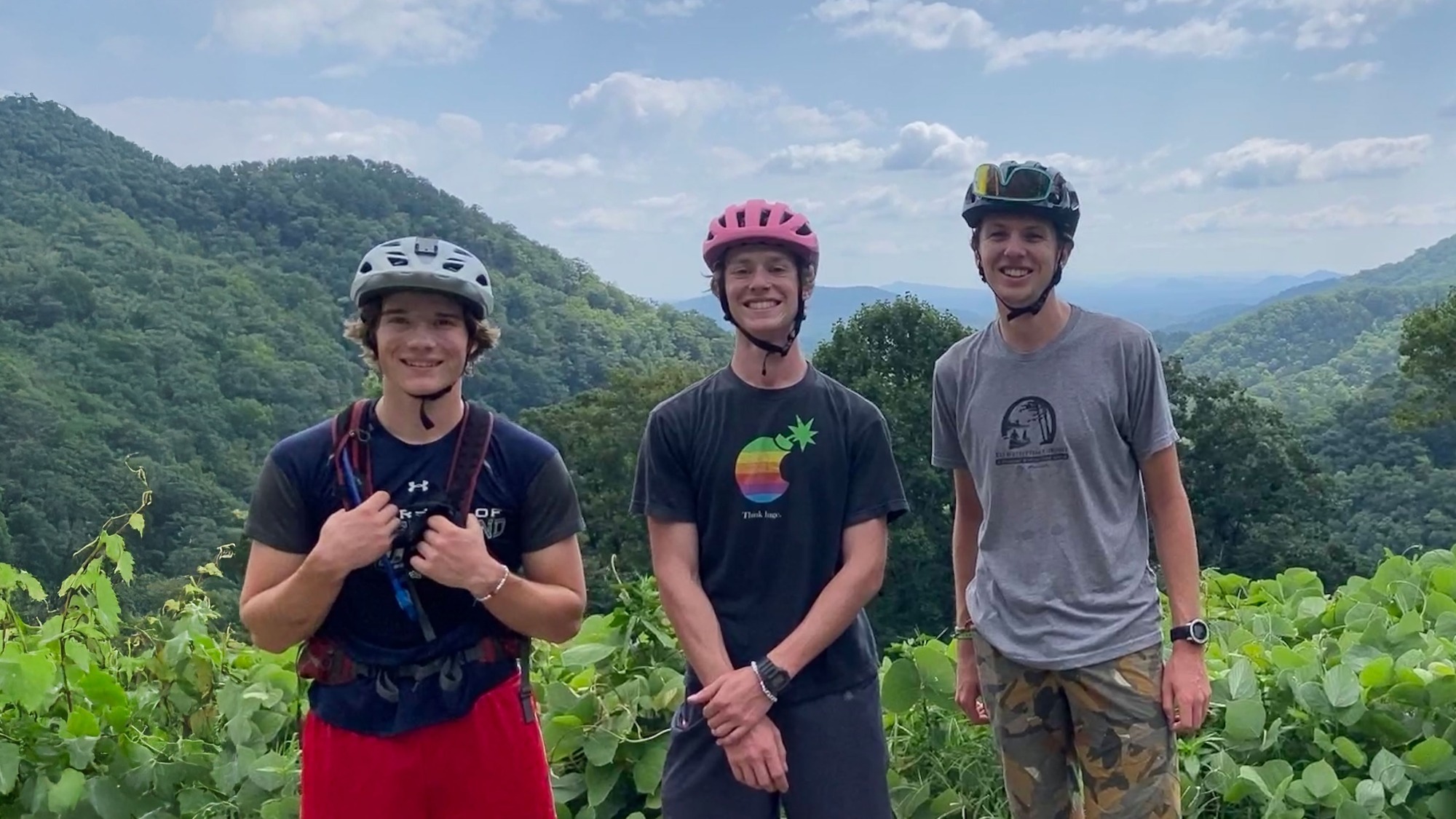 2025 Cycling Members, Eliot Heminway , Gabe Adler and Izaak Eichinger in front of the mountains