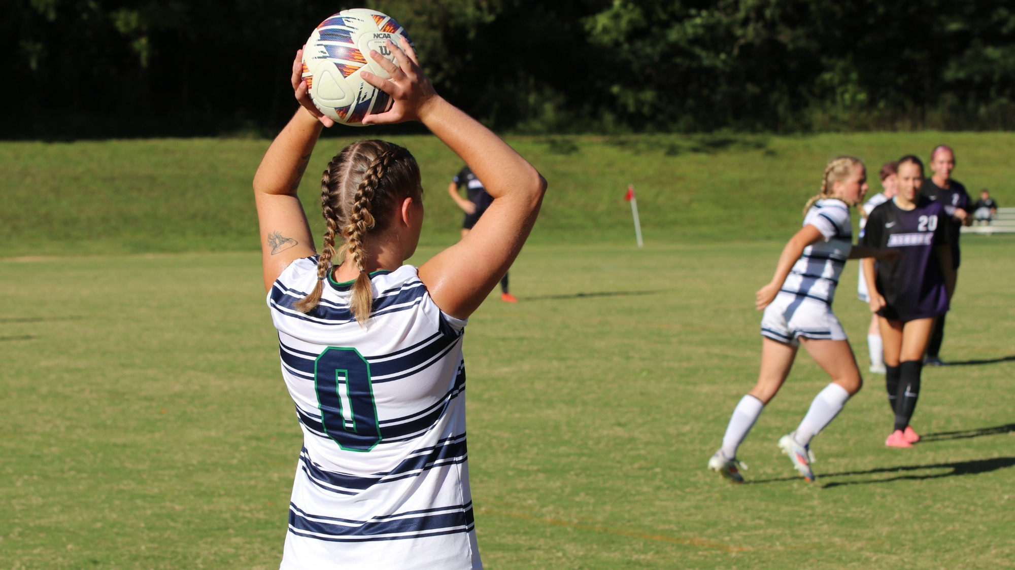 24-25 Women's Soccer player, Sabine Costello Sanders throws in the ball