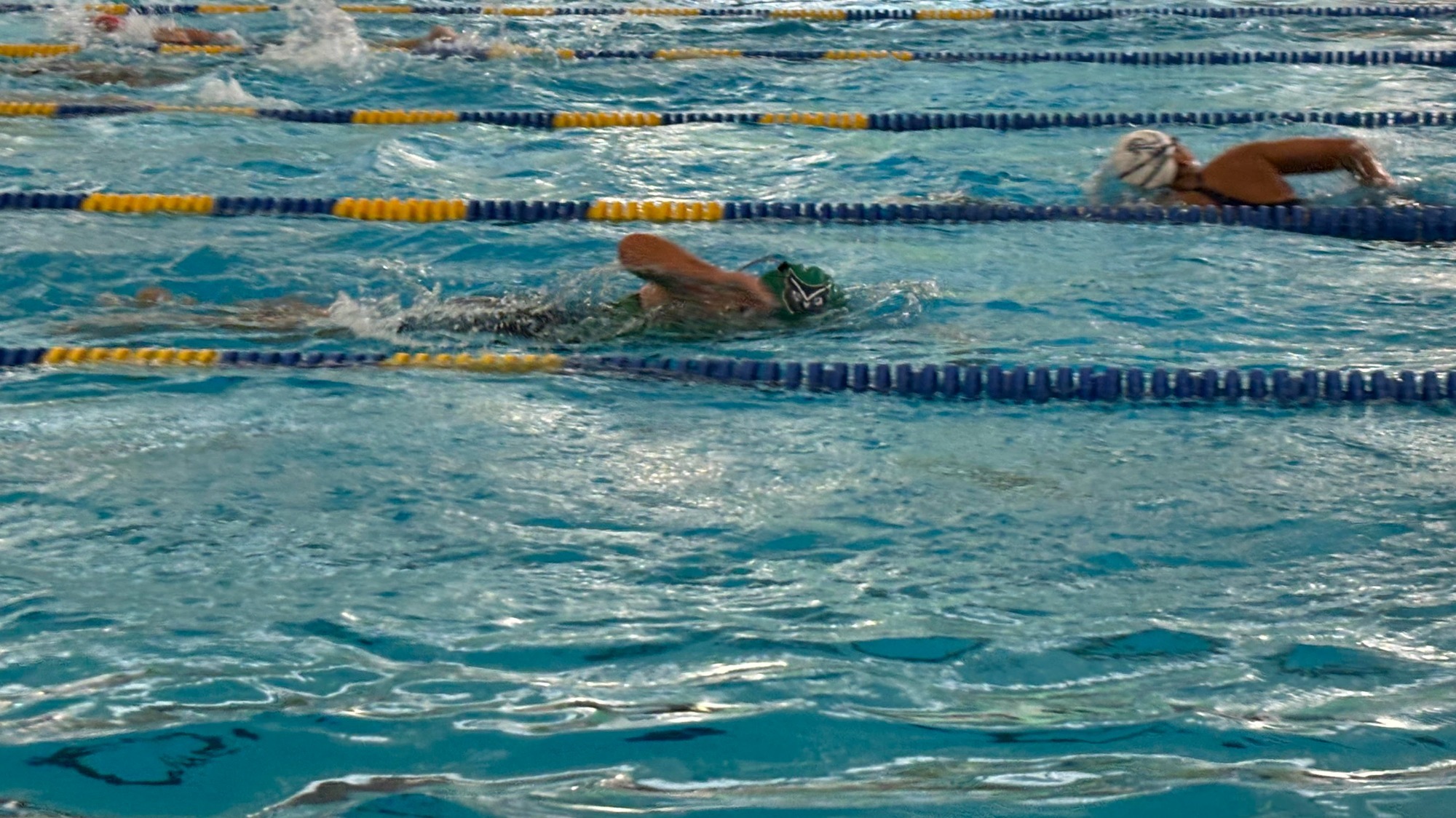 A Triatlon Athlete is swimming in the pool