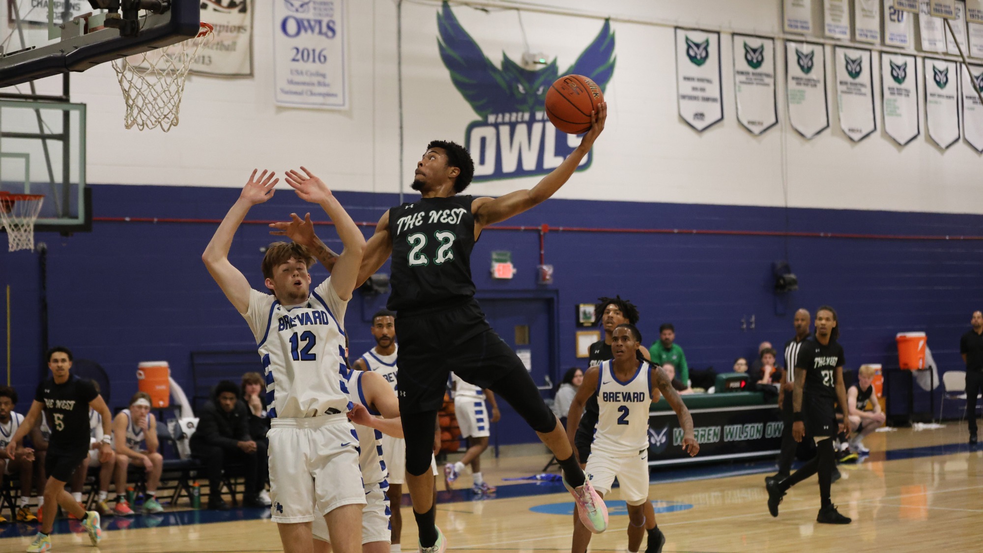 25-26 MBB Asheton Glass goes in for Dunk Over Opposing Player